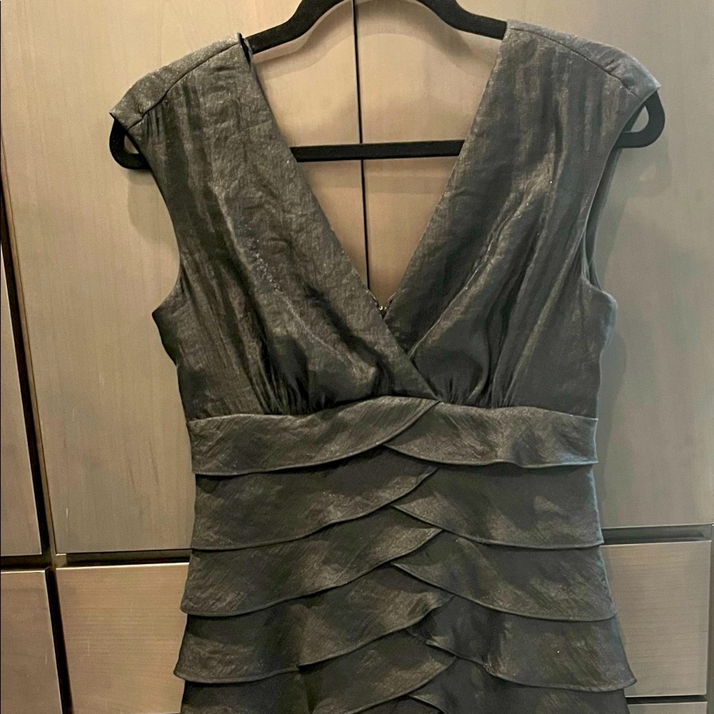Black layer fitted dress.  Looks and feels like silk! Size 4.